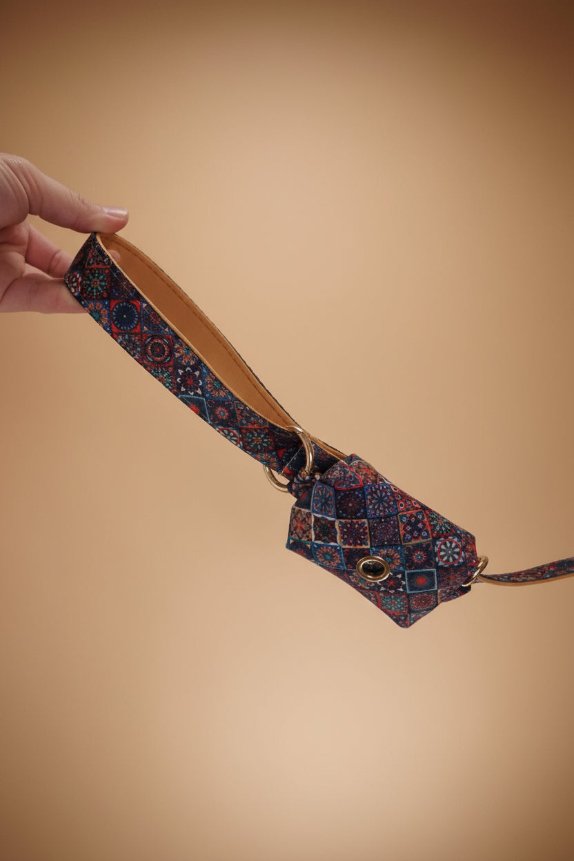 Patterned dog leash with dog poop bag holder attached, 