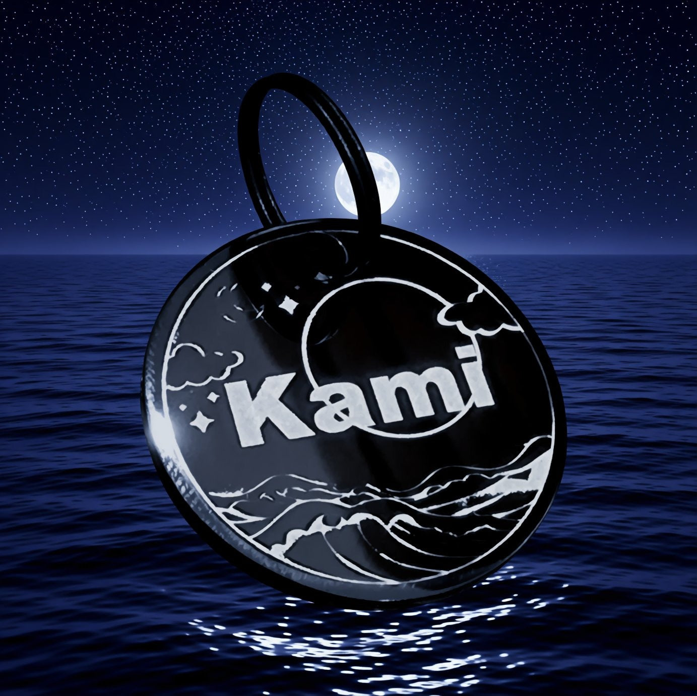 A black circular tag with the name "Kami" printed on it, floating on the surface of a body of water at night.