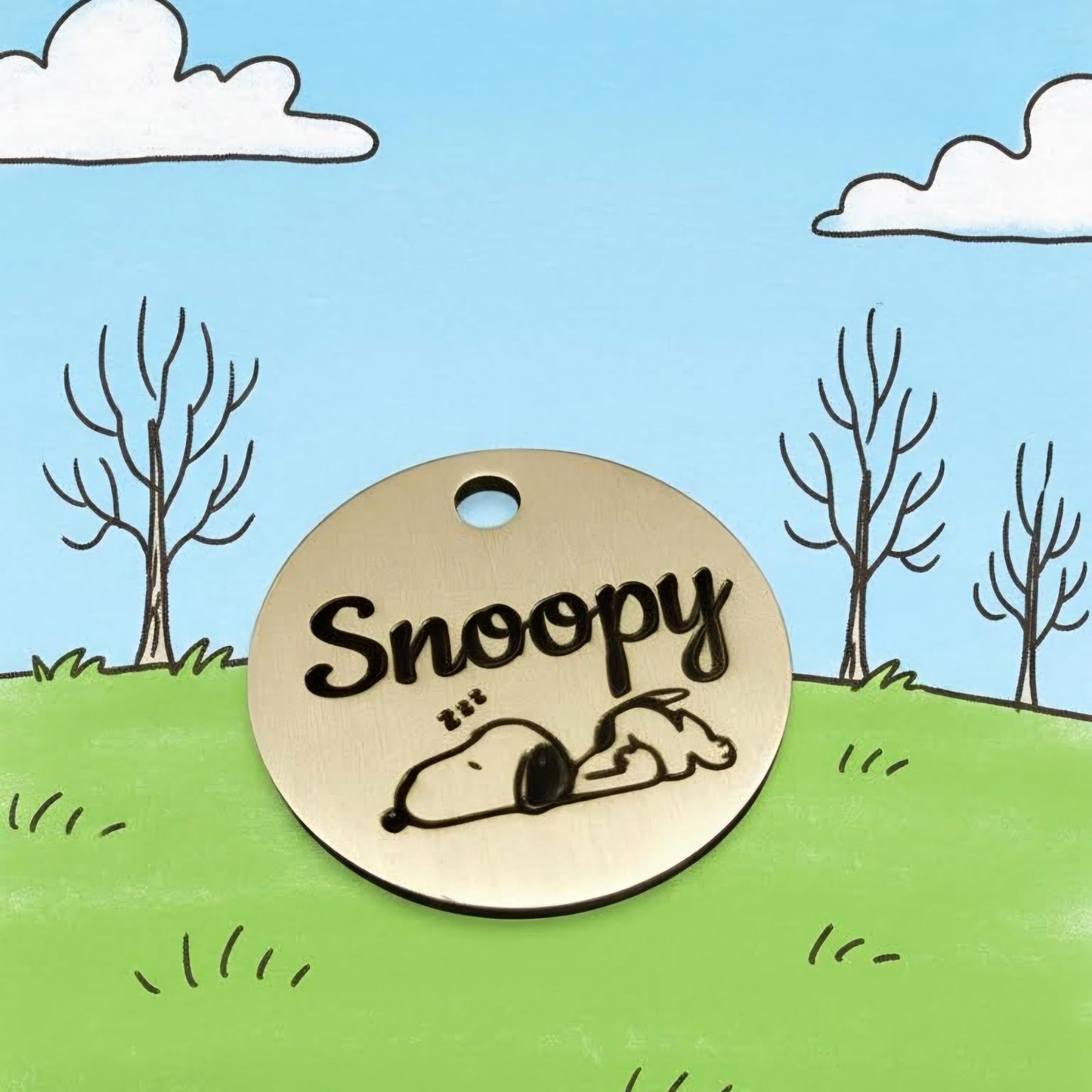 solid brass pet id tag with customers custom artwork of dog named snoopy on it.