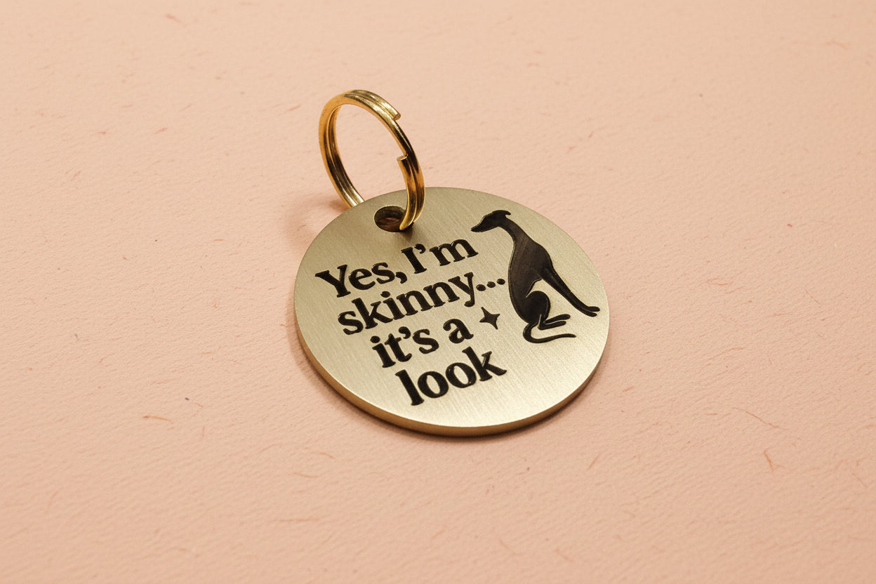 dog tag with humorous text and greyhound silhouette