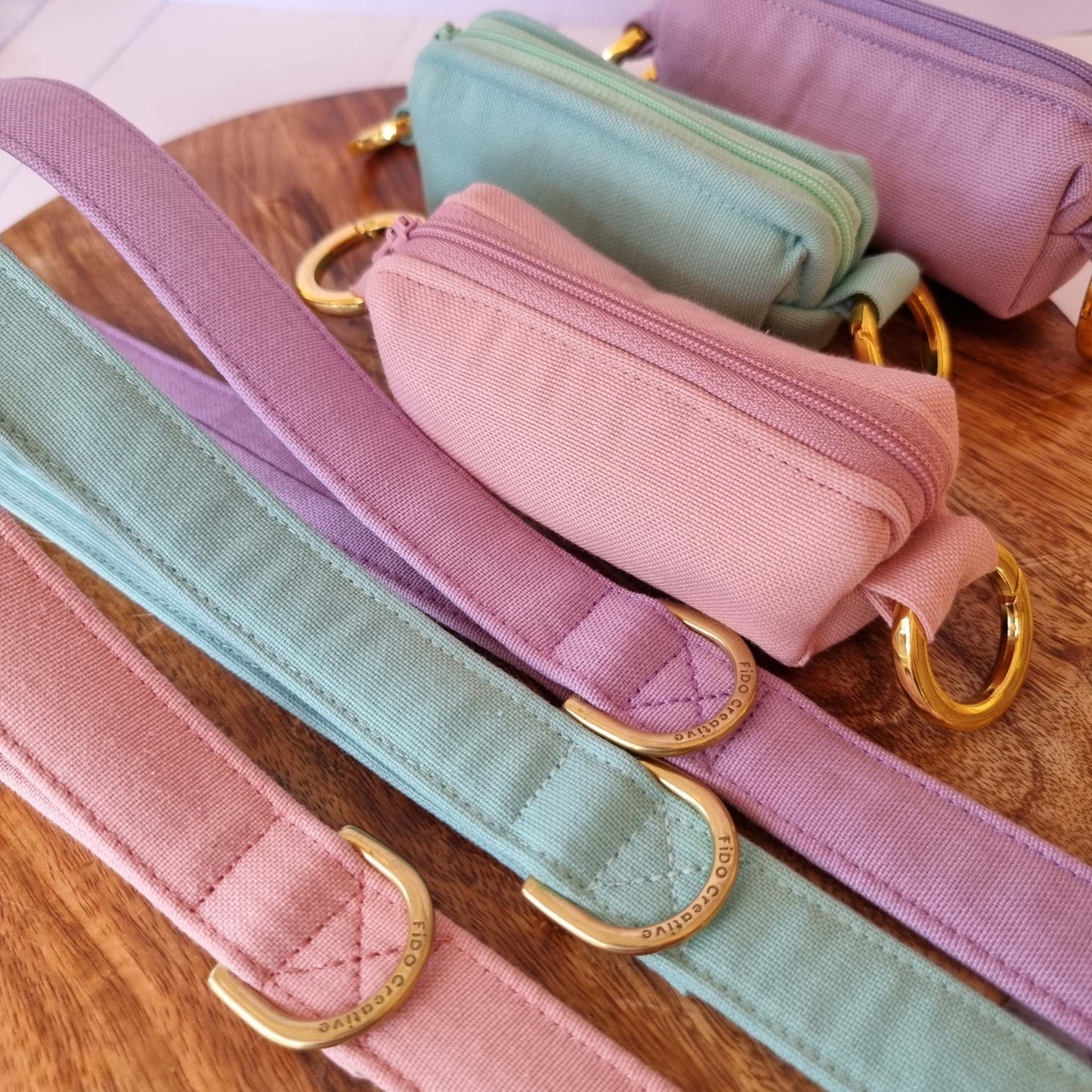 a pink piece of luggage sitting on a wooden floor 